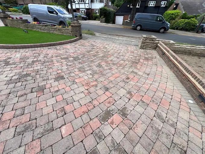 Clean curved block paving driveway outside a detached house in Bexley