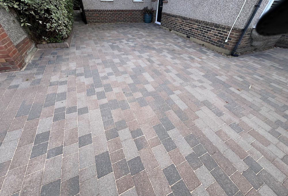 Finished multi-tone block paving driveway outside a Bexley home